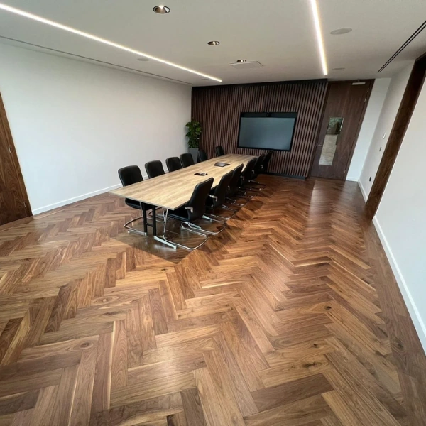 Dark oak chevron flooring in a modern office