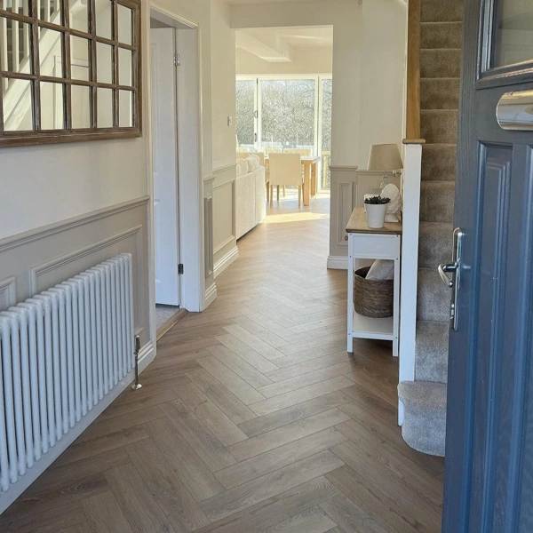 Light grey chevron wood floors in a hallway