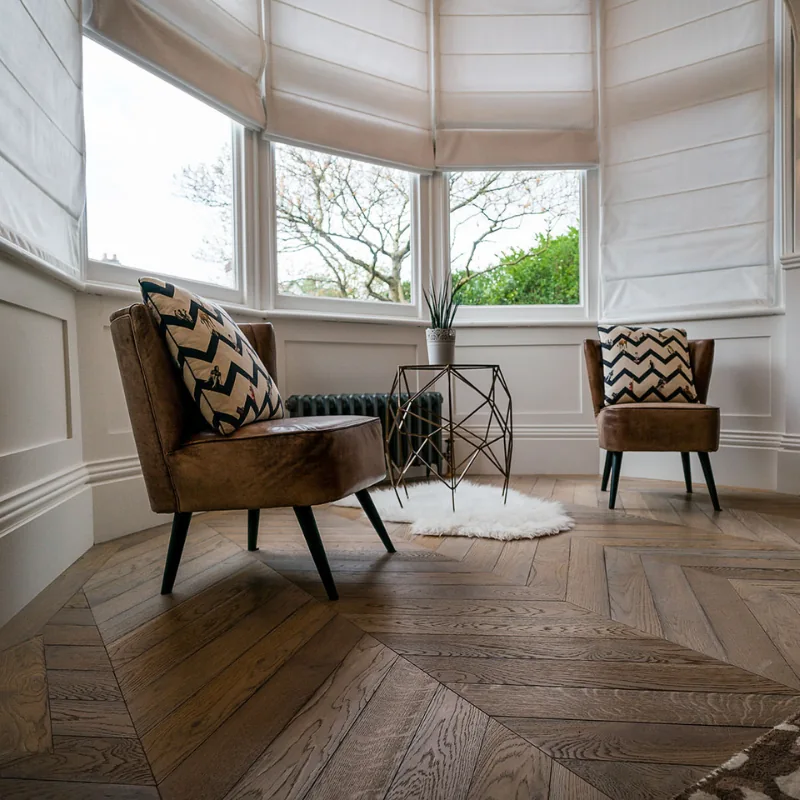 Light oak chevron flooring in a bay window