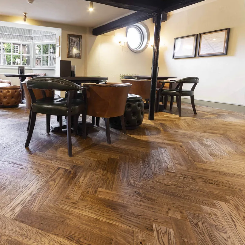 Medium oak herringbone parquet in a lounge