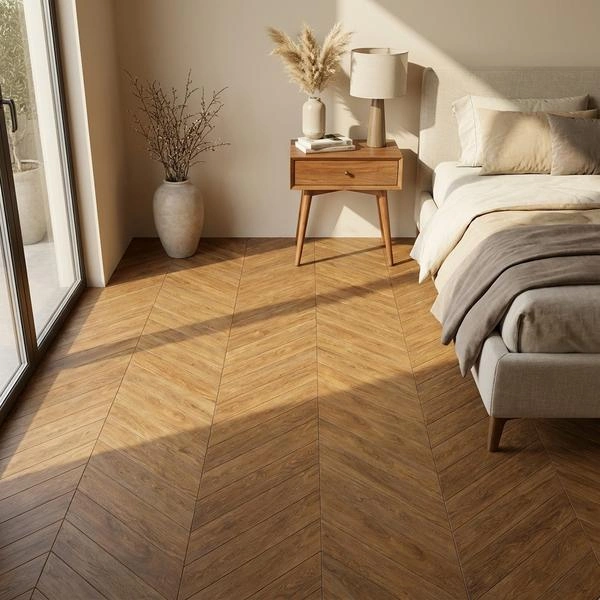 Natural oak chevron flooring in a cozy bedroom
