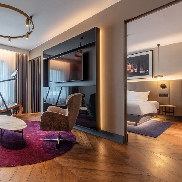 Warm oak chevron flooring in a hotel suite