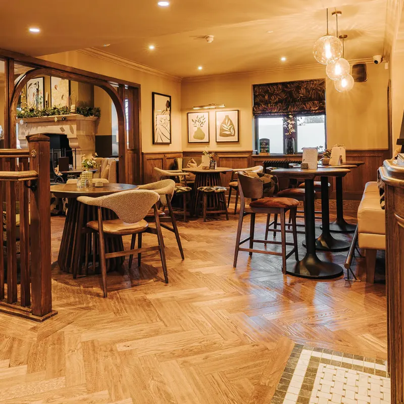 Warm oak herringbone flooring in a restaurant